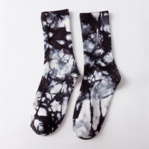 lose-up of tie dye socks in blue, pink, yellow, black, green and yellow