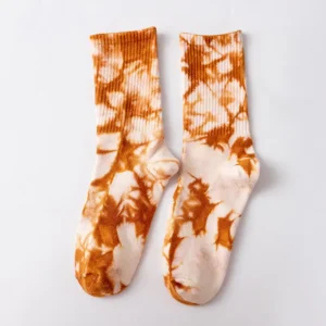 lose-up of tie dye socks in blue, pink, yellow, black, green and yellow