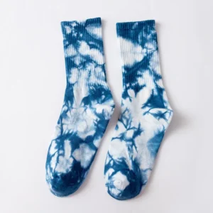 lose-up of tie dye socks in blue, pink, yellow, black, green and yellow