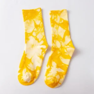 lose-up of tie dye socks in blue, pink, yellow, black, green and yellow